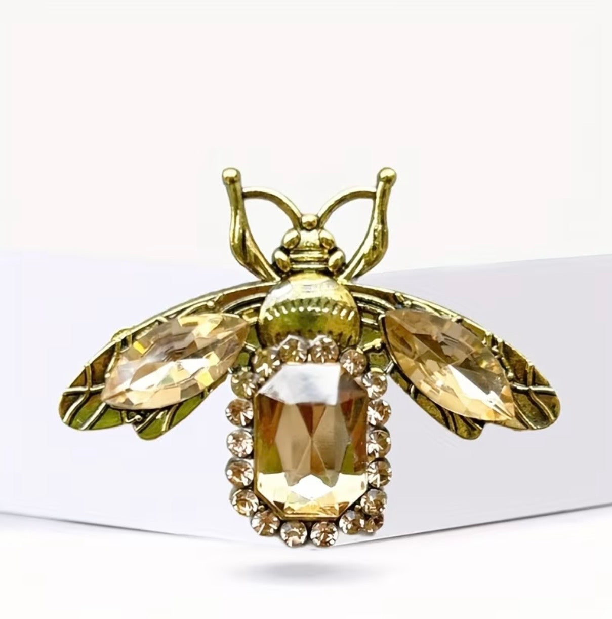 Golden cicada brooch